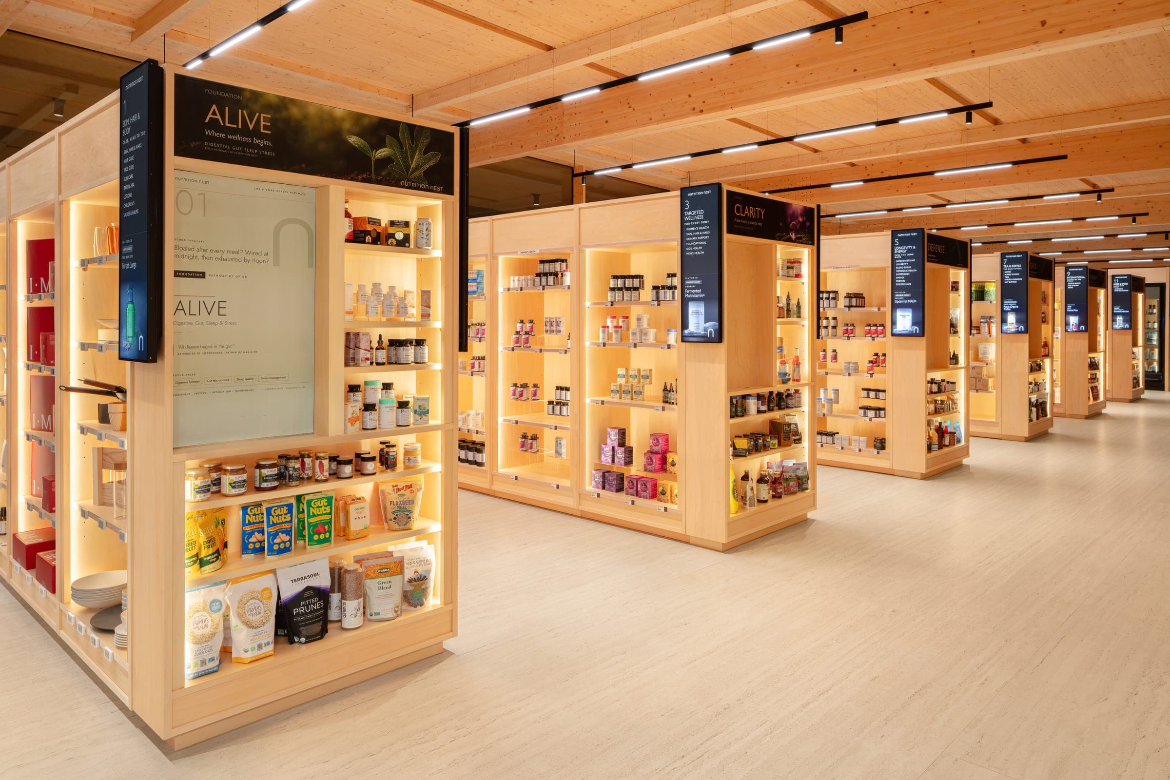The Functional Market — lit timber displays in rows, each headed by its pathway screen