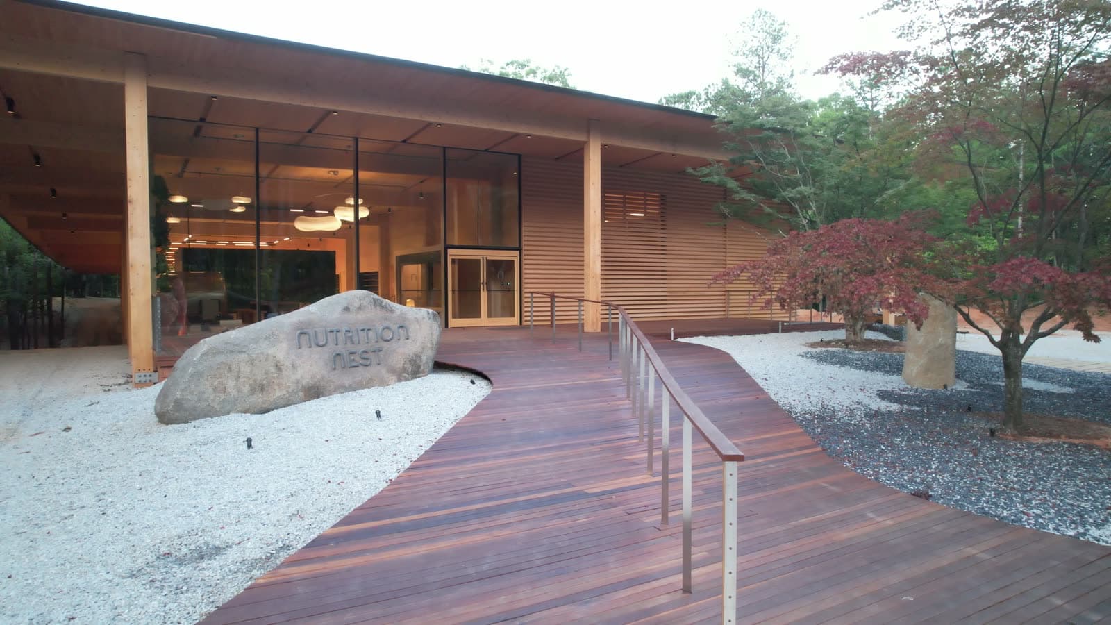 The deck at dusk, past the Nutrition Nest sign stone